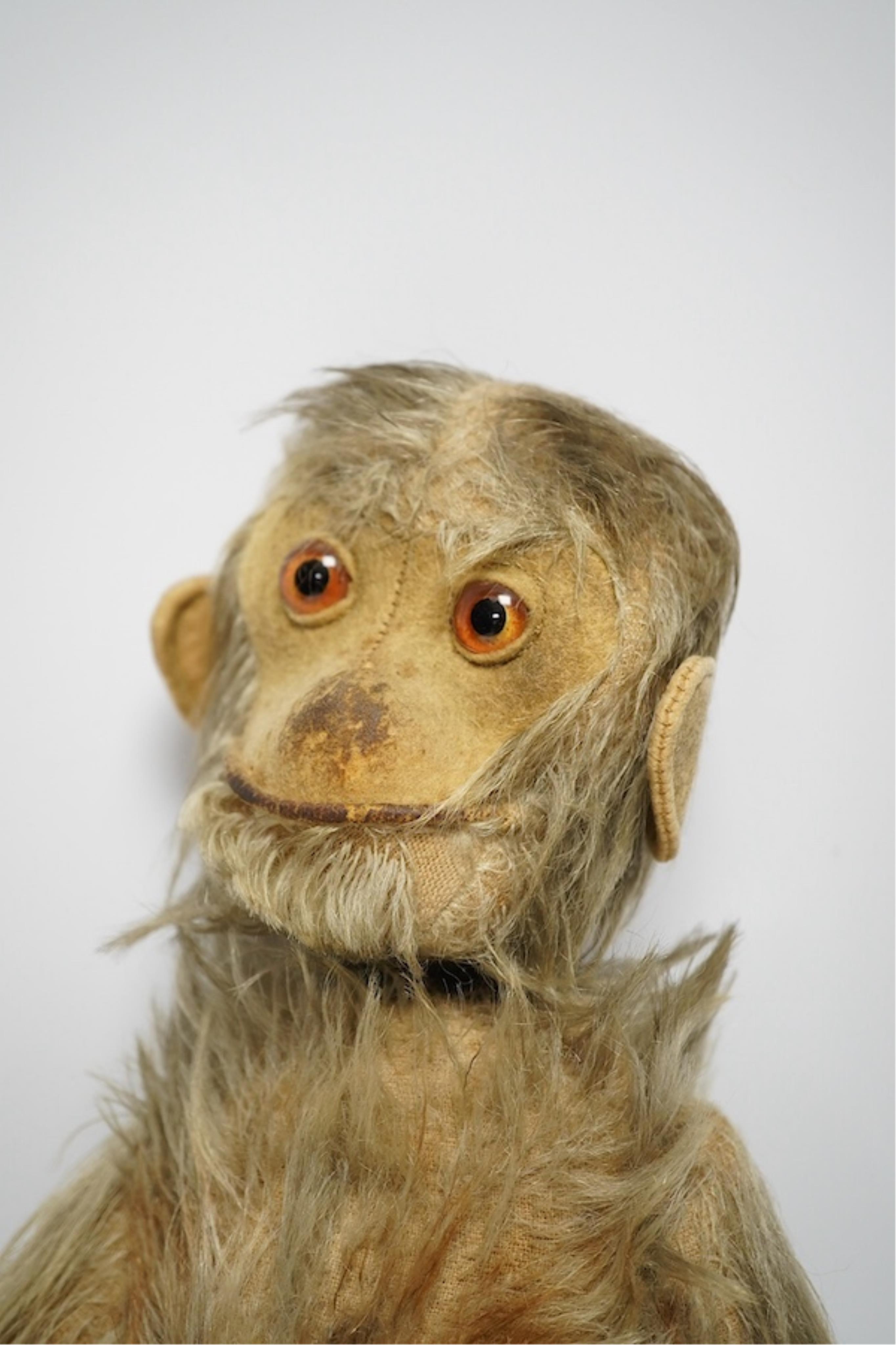 An early 20th century Schuco-type 'Yes No' monkey. Condition - fair, mechanism working